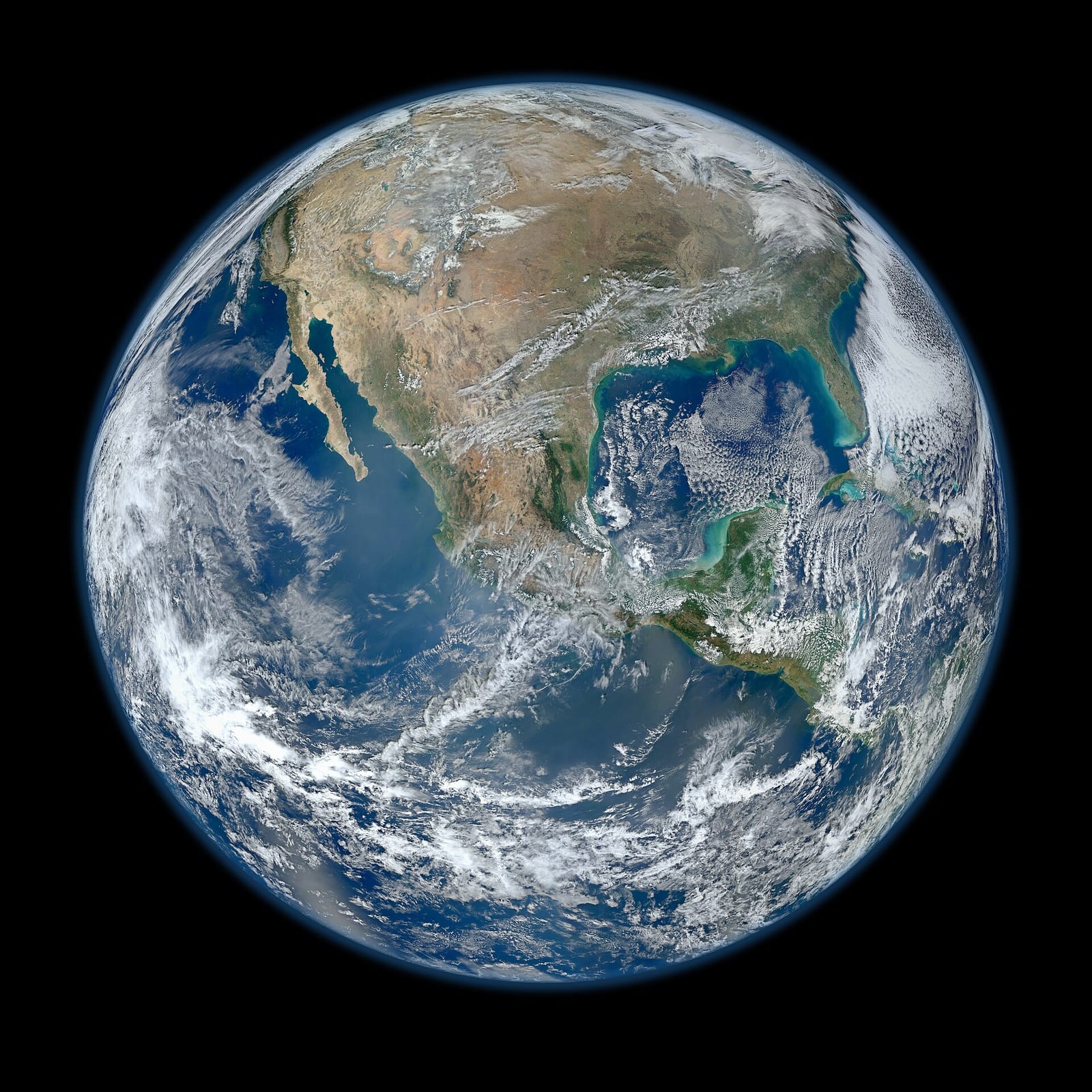 A view of most of North America taken from a low orbit of about 826 km altitude. The whole hemisphere is not visible owing to the low orbit, and the horizon is at a distance of about 3,300 km, while the radius of the planet is 6,371 km. The diameter seen from this height is about 125 degrees. An ima